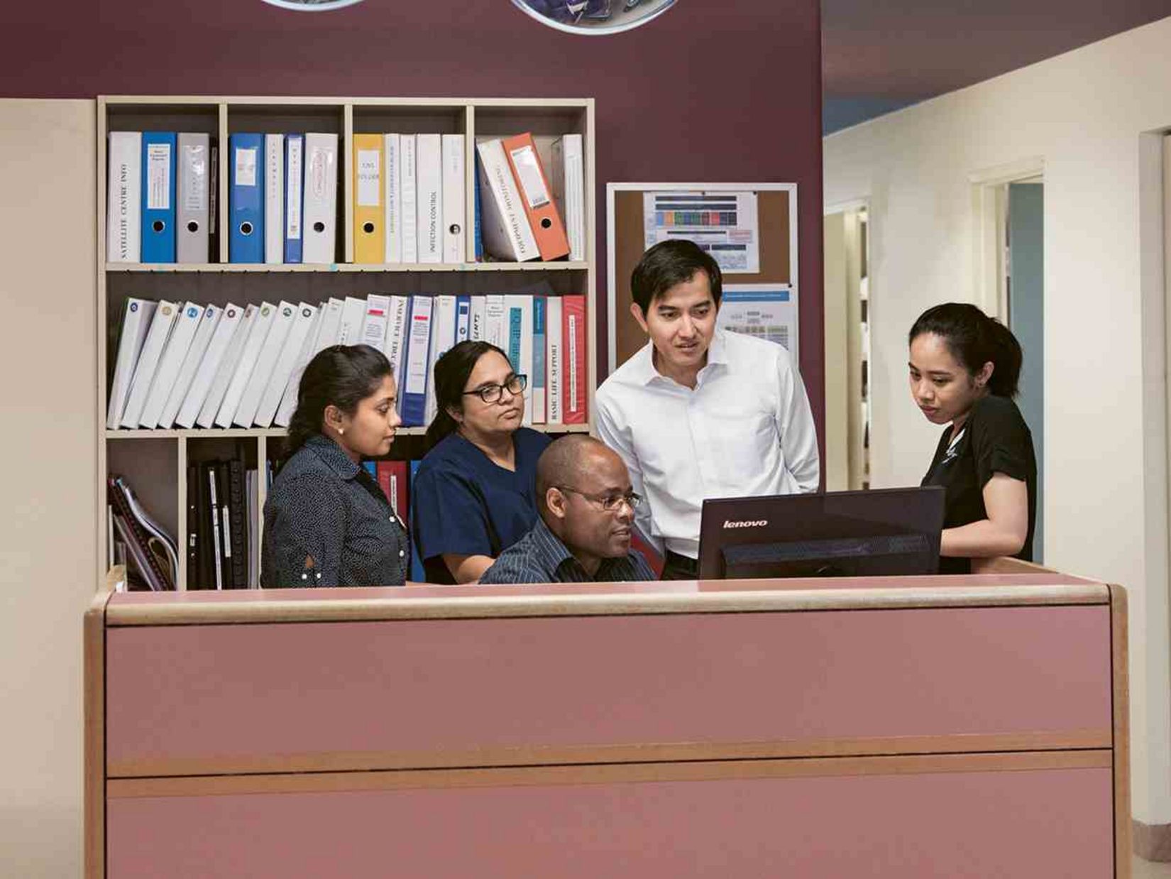 Dr. Sovann Kanitha and staff from the hospital