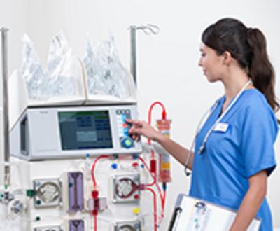 Nurse operating multiFiltrate Acute Therapy System