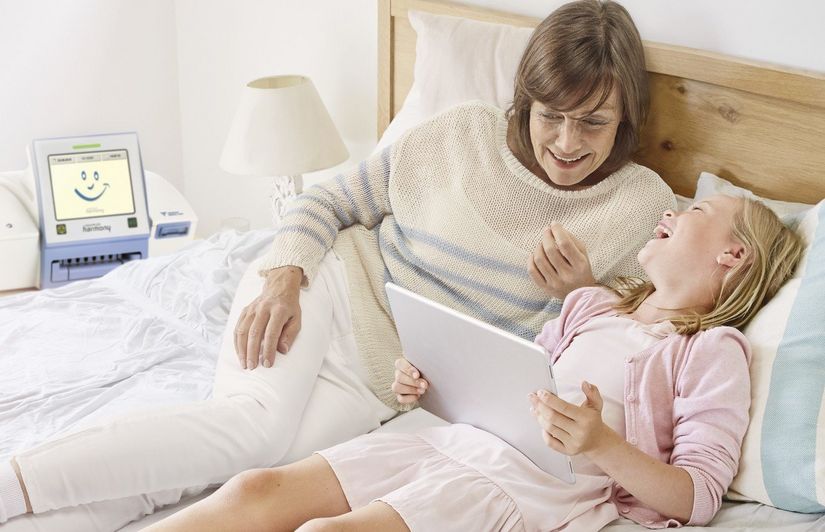 csm_BAS012_PD_patient_with_grandchild_5f939eb5ce-1